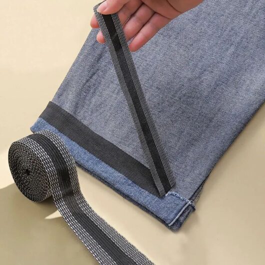 4m Black Iron-On Interlining for Shortening Trouser Hems for Jeans and Denim Garments, Ideal for DIY Sewing Projects.