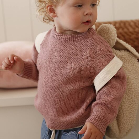 Knitted jumper for babies with embroidered flowers rose
