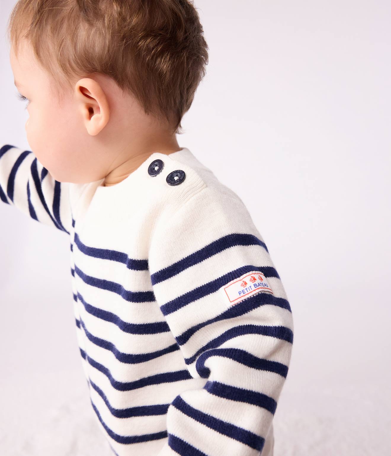 Wool and cotton striped sailor jumper for babies by PETIT BATEAU ecru