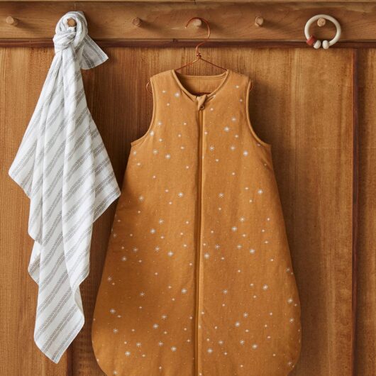 Baby Sleep Bag in Organic Cotton* with opening in the middle, Dreamy brown medium all over printed